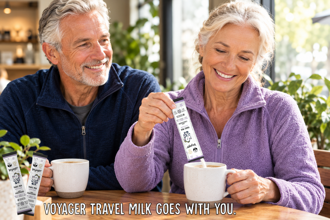 Active older couple on a hiking trail with a water bottle and a Voyager Goat Milk sachet